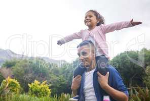 Be as free as you want to be. Shot of a young father and daughter spending time in nature.