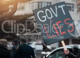 No longer tolerated. Cape Town, South African - October 2, 2021 Unrecognisable demonstrators holding up signs and protesting against government corruption.