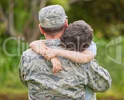 Tears flow from the eyes of loved ones. Shot of a father returning from the army hugging his son outside.