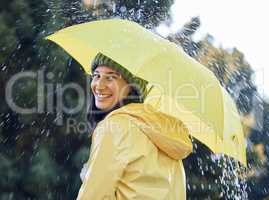 I hope youre covered in this rain. a woman out in the rain with a yellow raincoat an umbrella.