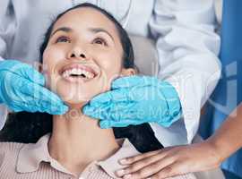 a job well done. a dentist checking their handiwork after a procedure.