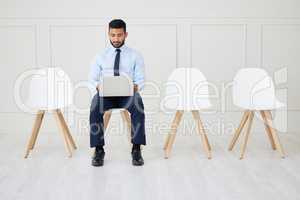 Fullbody asian businessman waiting for interview and using laptop. Applicant sitting alone, browsing internet on technology. Professional candidate in line for job opening, vacancy, office opportunity