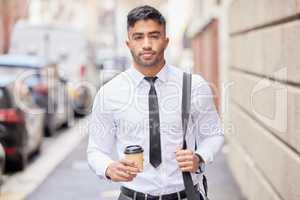 Walk with confidence. Cropped portrait of a handsome young businessman traveling through the city on his morning commute into work.