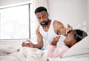 Starting the morning on a rough note. a father caring for his sick daughter at home.