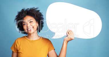 Make your opinion heard. an attractive young woman standing alone against a blue background in the studio and holding a chat bubble.