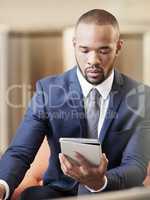 Business man working on his digital tablet. Young man using his business tablet. Business man working on his digital tablet. Young man using his business tablet.