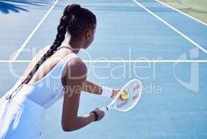 I just really want to have fun. an attractive young woman playing tennis outside.