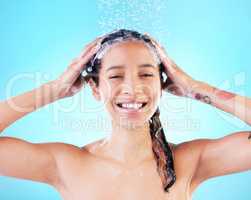 Make it a pamper day. a woman washing her hair against a blue background.