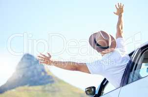 Roads are a record of those who have gone before. Shot of a unrecognizable man enjoying an adventurous ride in a car.