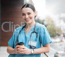 A coffee boost was necessary. a young female doctor having a coffee at work.