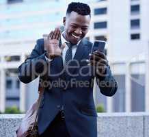 Meetings on the go. a young businessman using a phone in the city.