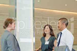 Business man and business woman meeting a concierge. Group of business people meeting their concierge in an airport