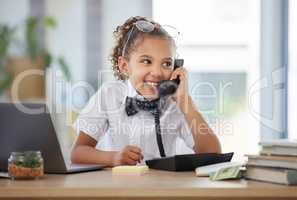 This sounds like a plan Im interested in. an adorable little girl dressed as a businessperson sitting in an office and using a telephone.