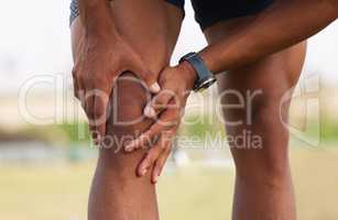 Dont over extend yourself. a man experiencing a knee cramp during a workout routine.