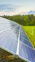 Solar power renewable source in Denmark. Photovoltaic solar cell panels as a natural energy source. Blue solar panels generate electricity in solar power technology, alternative energy from nature