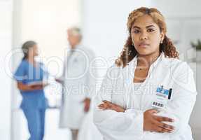 Your healthcare needs are always my top concern. Portrait of a young doctor standing with her arms crossed in a hospital.