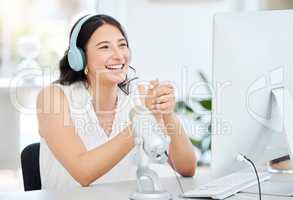 Stay tuned to find out more. Shot of a young woman working on a computer during a broadcast in an office.