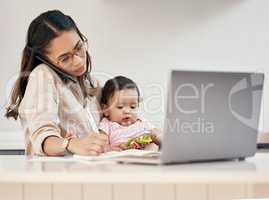 Juggling a full-time job and caring for my little one. Shot of a woman working on her laptop and talking on her cellphone while sitting with her baby on her lap.
