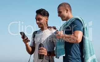 Its bring your bud to swim class day. two young men using a smartphone before going for a swim.