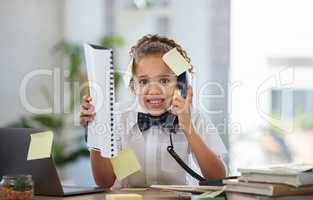 The tasks wont stop coming in. Shot of an adorable little girl dressed as a businessperson sitting and feeling stressed while using a telephone.