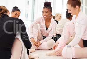 How are you doing today. a group of young ballerinas preparing for rehearsal.