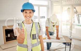 Your living space is going to look great. Shot of an attractive young construction worker standing inside and making a thumbs up gesture.