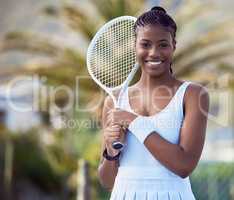 Its easier when you play. a young woman holding a racket on a tennis court.