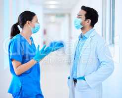 Getting onto the same page. a young dentist speaking to his assistant.