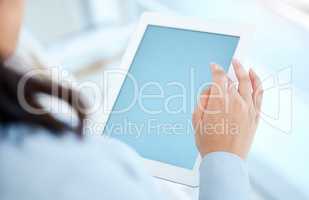 Get access to all you need in an instant. Closeup shot of an unrecognisable businesswoman using a digital tablet with a blank screen in an office.