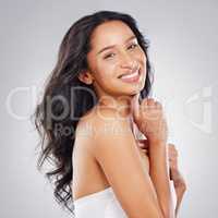 Its time for haircare. Cropped portrait of an attractive young woman posing in studio against a grey background.
