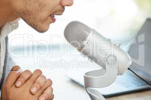 Thank you for tuning in today. Closeup shot of a businessman using a microphone during a broadcast in an office.