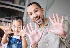 Our hands are clean. Shot of a man and his daughter showing their clean hands.