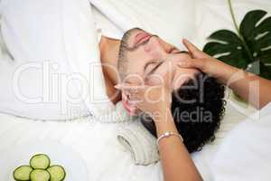 Forget your worries and enjoy a day of pampering. a handsome young man enjoying a facial at a spa.