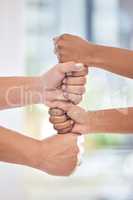 Unity breeds professional harmony. a group of business people with their hands stacked.