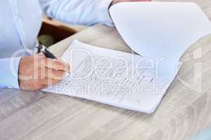 Patent filling medical form. Closeup of a business man writing on a healthcare document in an office. A doctor doing research on a patients medical history