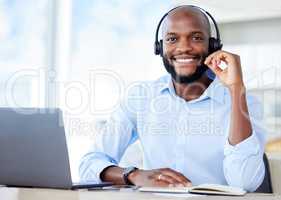 Black sales agents wearing a headset while working in a call centre. Helping with customer care and services