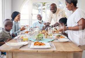 Families that eat together stay together. Shot of a family having lunch at home.