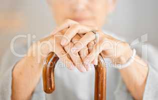 My body isnt the same as it used to be. Closeup shot of a senior woman holding a walking stick.