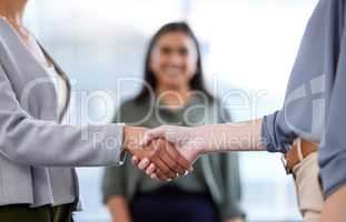 When you know youve made it to the winners circle. Shot of unrecognisable businesswomen shaking hands in a modern office.