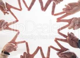 Go all in, get everything out. Shot shot of a group of unidentifiable businesspeople joining their hands together in a unity.
