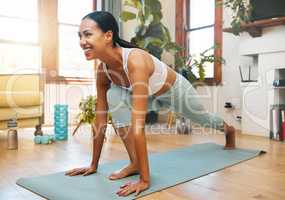 Improving her flexibility and strength with every stretch. a sporty young woman doing lunge exercises at home.