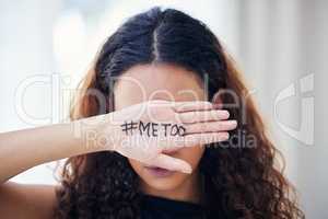 When will our suffering end. Shot of an unrecognisable woman with the hashtag me too written on her hand.