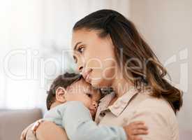 There may be a lot of crying but there are many moments to savour. Shot of a young mother bonding with her adorable baby at home.