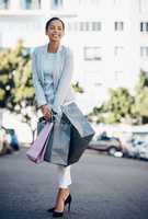 The only baggage Im interested in. Shot of a beautiful young woman enjoying a day of shopping.