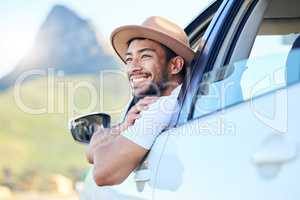 Its not the destination, its the journey. Shot of a young man enjoying an adventurous ride in a car.