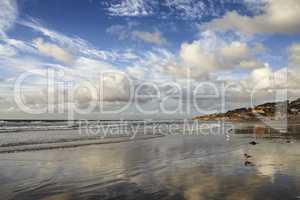 Stunning beach landscape of the sea on a cloudy day with copy space. Calm waves at the shore on a quiet coastline with peaceful blue horizon. Scenic nature at travel location in San Diego, California