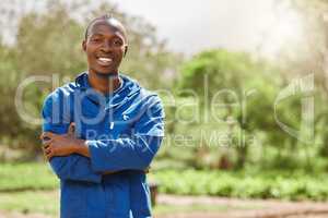 Everything is fresh on this farm. Cropped portrait of a handsome young male farm worker tending to the crops.