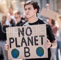 We have no other options. a young man holding a climate change poster during a rally.