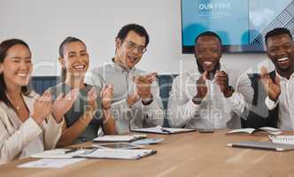 A group of young diverse and confident corporate business people clapping while sitting in the boardroom during a work meeting. Celebrating the success and promotion of a coworker. Were happy for you