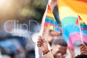 Fly your flag high. LGBTQ flags being flown during a rally.